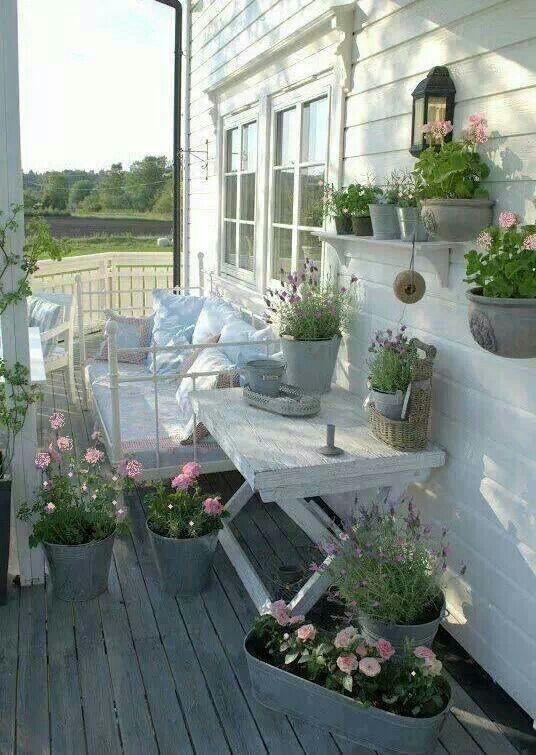 veranda-fiori-rosa-vasi